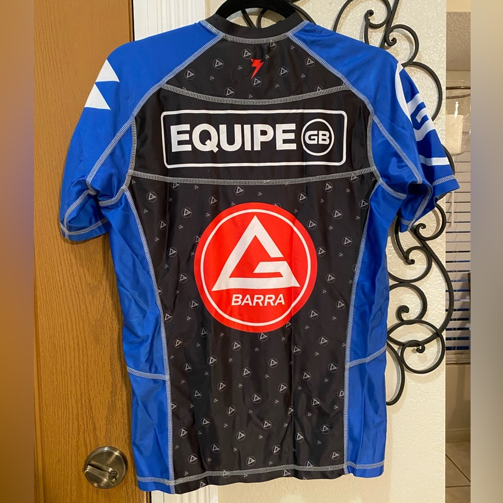 Lightly used Gracie Barra blue belt rashguard